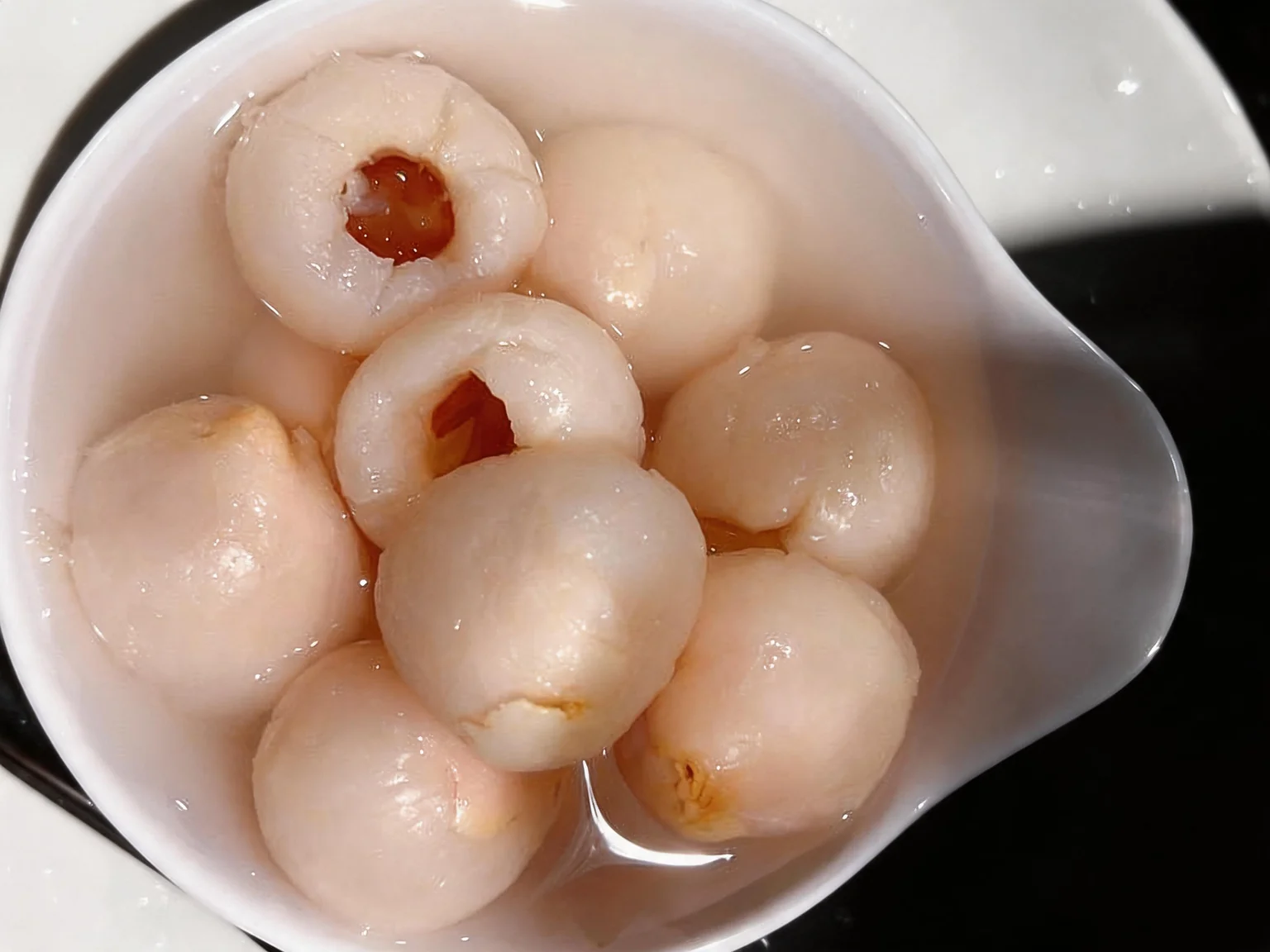 Lychee. In a white bowl.